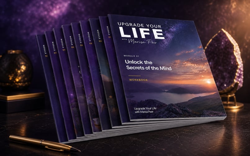 Complete set of Upgrade Your Life module workbooks on a premium purple studio background